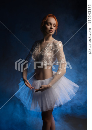 Beauty and artistry blend in light with a nude model in a dreamlike setting 130343383