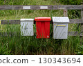 Various colorful roadside mailboxes in rural Sweden 130343694