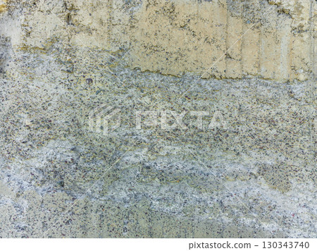 Damaged concrete wall texture, exposed aggregate, crumbling surface, construction defect, weathered cement, textured, nobody, no people 130343740