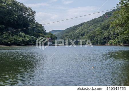 The calm surface of Lake Enryada in summer 130343763