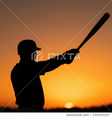 Silhouette of a batter against a sunset background 130344225