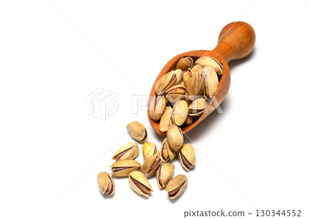 Heap pistachios isolated on white background, close up. 130344552
