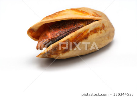 Heap pistachios isolated on white background, close up. Heap pistachios isolated on white background, close up. 130344553