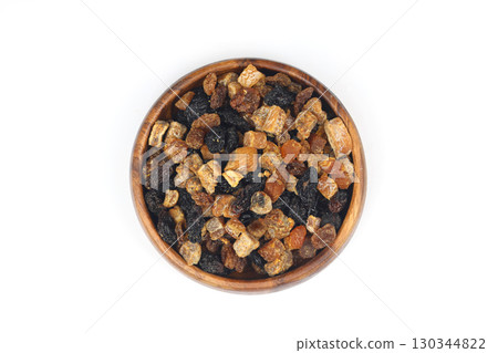 Mix of nuts and dried fruits in wooden bowl isolated on a white background. 130344822