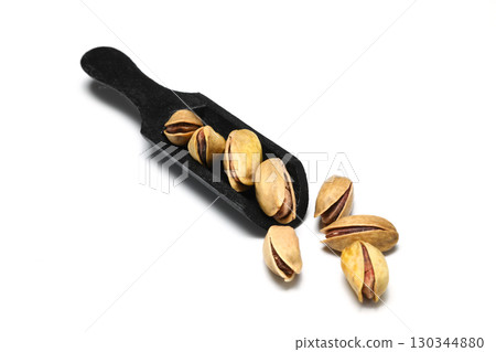 Heap pistachios isolated on white background, close up. 130344880
