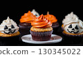 Set of Halloween theme decorated cupcakes with creamy frosting and funny faces 130345022