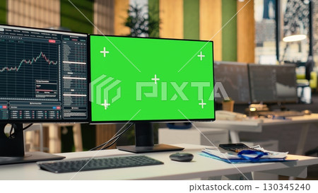 Stock market metrics charts displayed on green screen computer display in investment firm office. Workstation in forex company workspace with live financial data visible on chroma key PC Stock market metrics charts displayed on green screen computer display in investment firm office. Workstation in forex company workspace with live financial data visible on chroma key PC 130345240