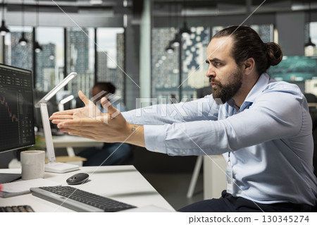 Prop firm trader showing frustration after stock market shares price drop affecting positions. Brokerage company employee feeling angry after losing money while buying and selling on trading platform Prop firm trader showing frustration after stock market shares price drop affecting positions. Brokerage company employee feeling angry after losing money while buying and selling on trading platform 130345274