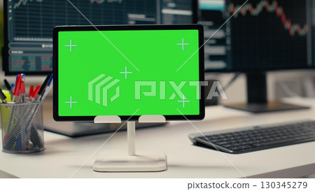 Trading software in prop firm office with graphs on isolated screen tablet. Mockup device on desk used by financial experts tracking stock market activity using analytical tools 130345279