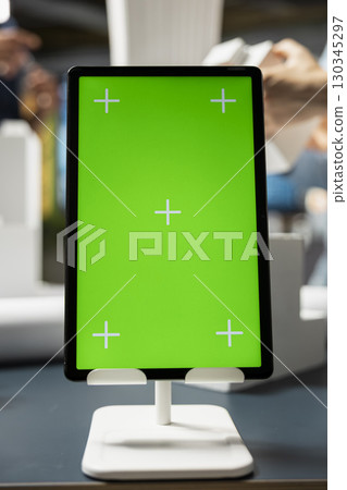 Close up of isolated green screen in an architect office space, 3D building models analyzed and studied for construction site preparation details. Infrastructure growth in a modern smart city. 130345297