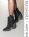 beautiful and elegant black shoes on a girl 130345356