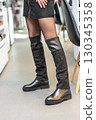 girl in black skirt and black shoes 130345358