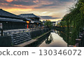 Sunset in a city with waterways 130346072
