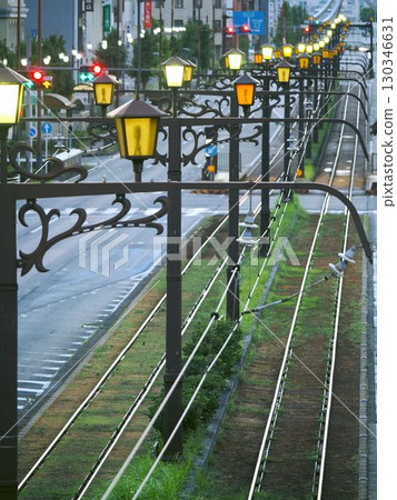 Tram tracks and lighting near Toyohashi Station 130346631