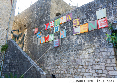 Alphabetical signs on the wall along the stairs 130346835
