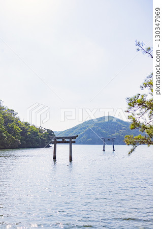 Tsushima Watatsumi Shrine Torii Gate Standing in the Sea Tsushima Watatsumi Shrine Torii Gate Standing in the Sea 130347969