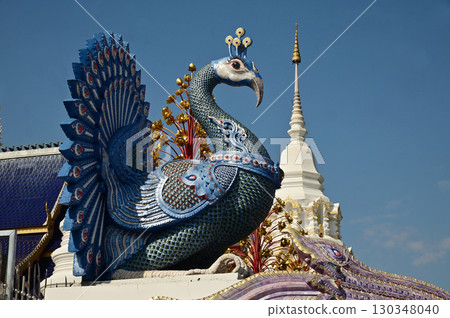 The statues of peacock in Thai literature are Thai art that decorate the front of the pagoda at Wat Den Sali Si Mueang Kaen temple. Located at Chiang Mai Province in Thailand. 130348040