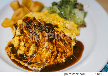 Omelette rice with demi-glace sauce - One-plate lunch Omelette rice with demi-glace sauce - One-plate lunch 130348430