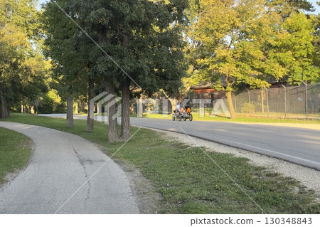 People riding quad bike in park 130348843