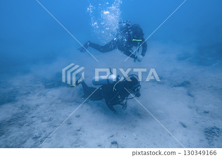 A man and a woman divers underwater in the South China Sea in Vietnam 130349166