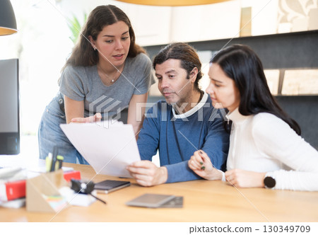 manager helps customers place an order and deliver furniture manager helps customers place an order and deliver furniture 130349709