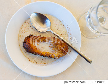 Traditional Spanish Holy Week Torrija de leche with creamy sauce Traditional Spanish Holy Week Torrija de leche with creamy sauce 130349895