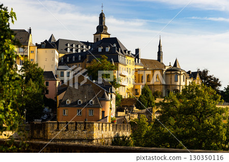 Summer view of Ville Haute with Saint Michael Church in Luxembourg City Summer view of Ville Haute with Saint Michael Church in Luxembourg City 130350116