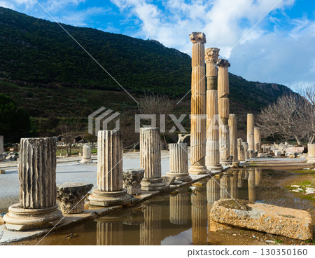 Ruins of the Upper Agora at Ephesus ancient site in Turkey. View of fragments of columns; with Sacred Street and Odeon 130350160