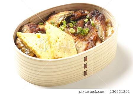 Eel bowl bento in a bento box photographed against a white background 130351291