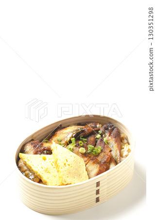 Eel bowl bento in a bento box photographed against a white background 130351298