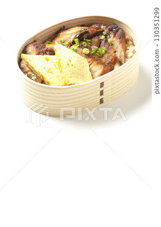 Eel bowl bento in a bento box photographed against a white background 130351299