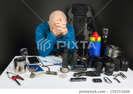 Preparing for an outdoor adventure while feeling overwhelmed by gear and supplies 130351686