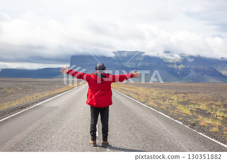 Exploring vast landscapes in Iceland with open arms Exploring vast landscapes in Iceland with open arms 130351882