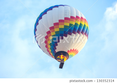 Colorful hot air balloon soaring in the sky above Turkey during a sunny day 130352314