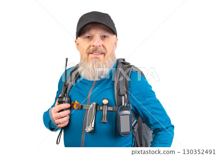 Explorer prepares for adventure with gear in studio setting on bright background 130352491