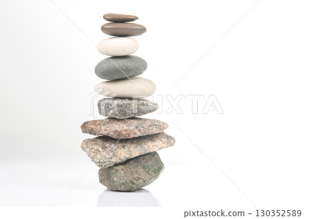 Balanced stack of stones showing harmony and tranquility in a minimalist setting Balanced stack of stones showing harmony and tranquility in a minimalist setting 130352589