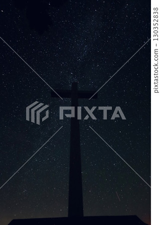 A cross floating in the starry sky 130352838