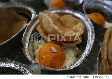 A prasad plate containing food offered during Hindu religious rituals A prasad plate containing food offered during Hindu religious rituals 130352935