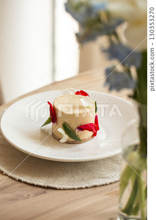 Elegant mousse dessert with flower petals 130353270