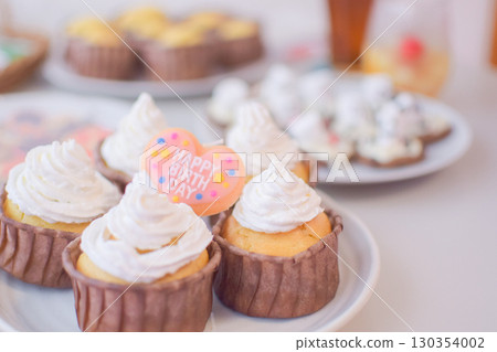 Halloween party with muffins and marshmallow cookies Halloween party with muffins and marshmallow cookies 130354002