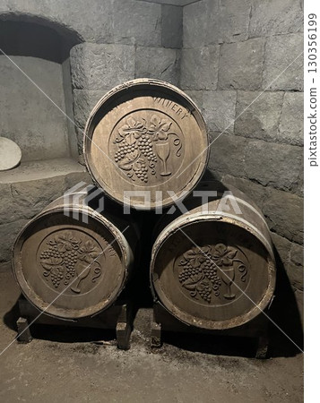 Barrels stored in an underground winery 130356199