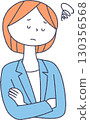 A woman wearing a suit with a troubled expression 130356568