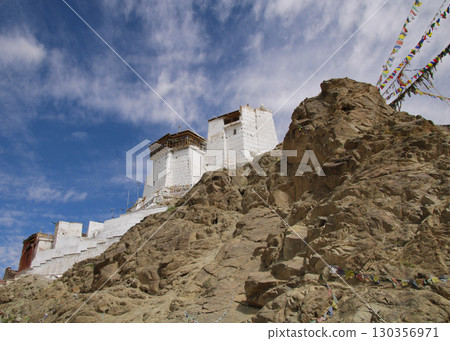 Tsemo Castle like an eagles nest enthroned above Leh and prayer flags, India. Tsemo Castle like an eagles nest enthroned above Leh and prayer flags, India. 130356971
