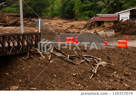 Flood Damage with Barricades and Destroyed Bridge Area 130357074
