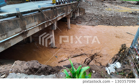 Flooded River and Damaged Bridge Flooded River and Damaged Bridge 130357096