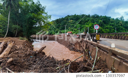 Flooded River and Damaged Bridge Flooded River and Damaged Bridge 130357097