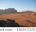 Wadi Rum desert and rocky mountains at sunset 130357370
