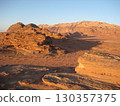 Wadi Rum at dusk as shadows fall over the desert 130357375