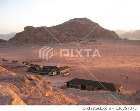 Wadi Rum dyed red at dusk 130357376