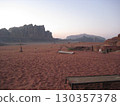 Wadi Rum desert and rocky mountains at sunset 130357378